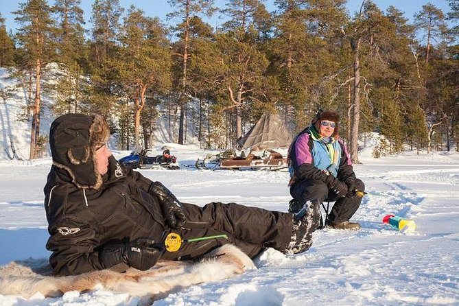 From Kakslauttanen: Ice Fishing Safari to Lake Inari, inc. lunch - The snowmobile sleigh ride to Koppelo and a secret fishing place