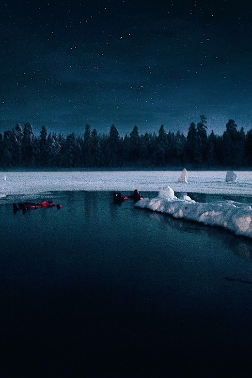 From Rovaniemi: Ice Floating under Aurora Borealis - Photos While You Float: How the Guides Help