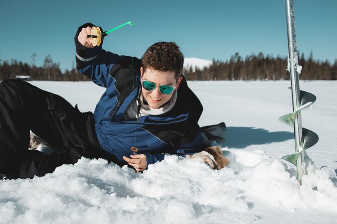 Lappish Lunch Break -Snowmobiling, ice fishing and tasty food - The secret ice-fishing hole, and what the lesson is really for