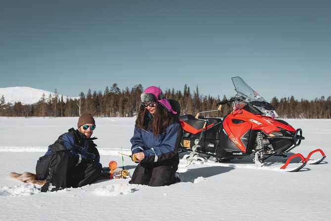 Lappish Lunch Break -Snowmobiling, ice fishing and tasty food - Suiting up for real cold, not just a photo-op
