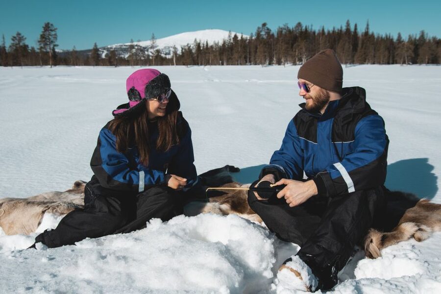 Levi: Finnish Ice Fishing Tour by Car - A Frozen Forest Pause, Campfire Heat, and Hot Drinks