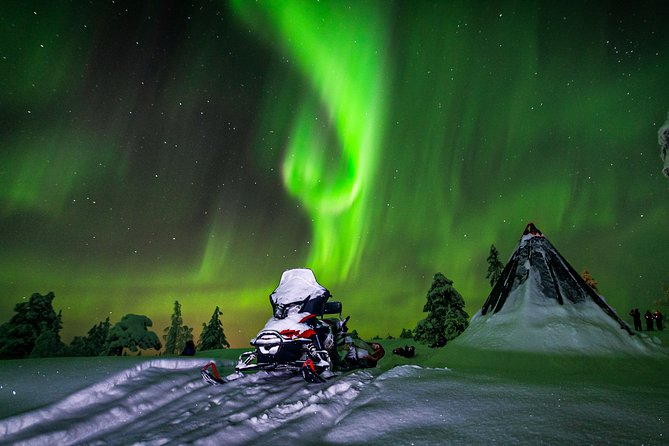 Northern Lights Snowmobile Sleigh Ride - Tepee fire stop: snacks, warm drinks, and a story while you wait