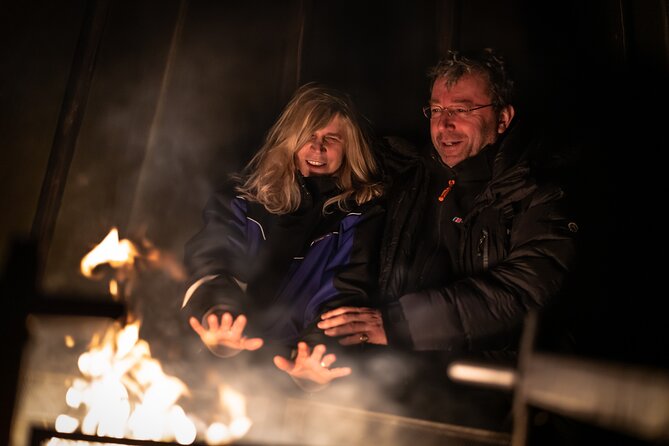 Northern lights tour to Lake Inari from Ivalo, Reindeers & Dinner - The island stop: dinner by fire, hot drinks, and a teepee meal