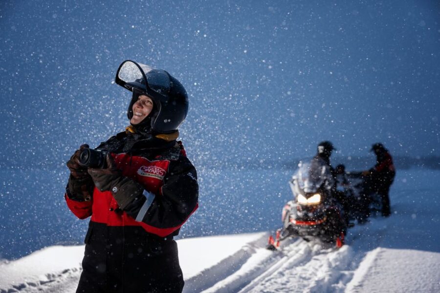 Ruka: Starlight sledging to search for Northern Lights - The sled safari: snowmobile power, comfortable seating, and real night-sky focus