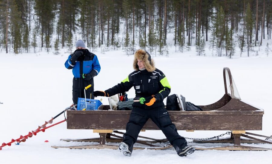 Saariselkä: Ice Fishing Safari by Snowmobile - Drilling the hole and setting up your ice fishing spot