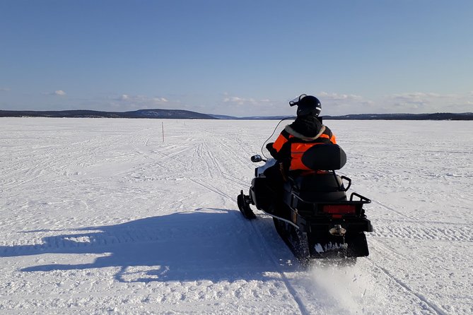 Snowmobile Safari to Lake Inari, meet & feed Reindeers, Lunch - Meeting Reindeer on a Small Island: The Teepee Camp Moment