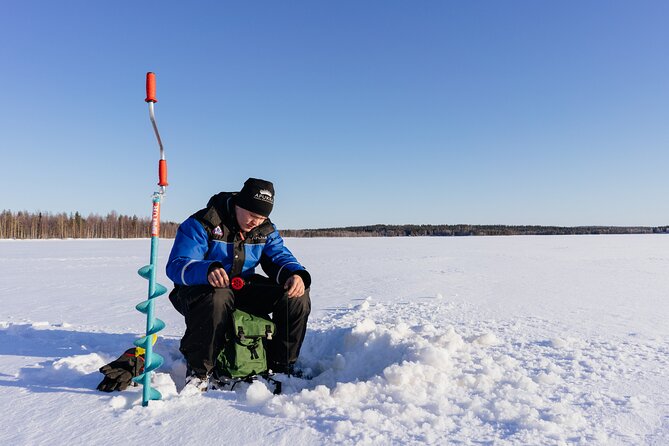 Snowmobiling and ice fishing in Apukka Resort, Rovaniemi - The Snowmobile Ride Through Snowy Forest and Hills