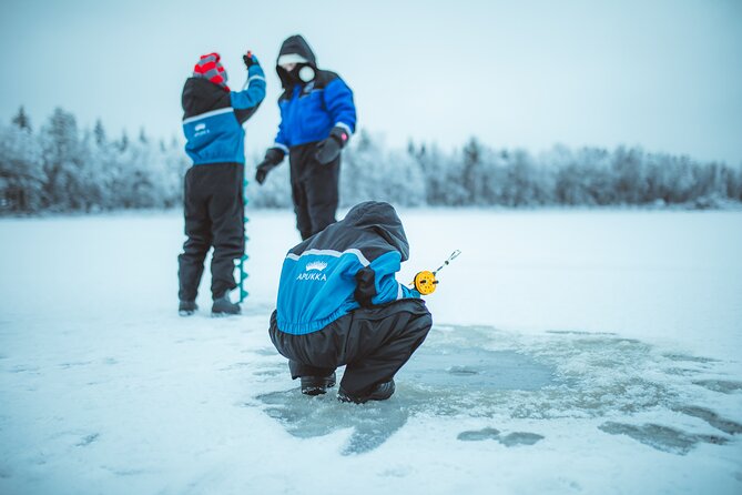 Snowmobiling and ice fishing in Apukka Resort, Rovaniemi - Ice Fishing on a Frozen Pond: Pike, Perch, and Trout