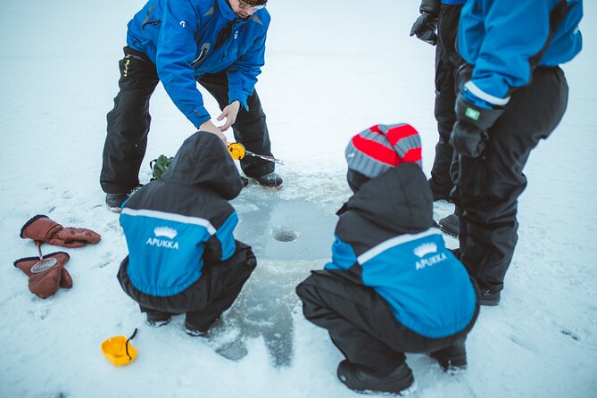 Snowmobiling and ice fishing in Apukka Resort, Rovaniemi - What to Wear for Subzero Winter Days