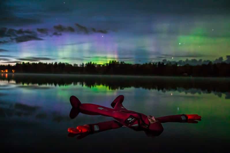 Ylläs: Northern Lights Ice-Floating Experience with Transfer - Ice-hole floating between blocks: what the actual water time feels like